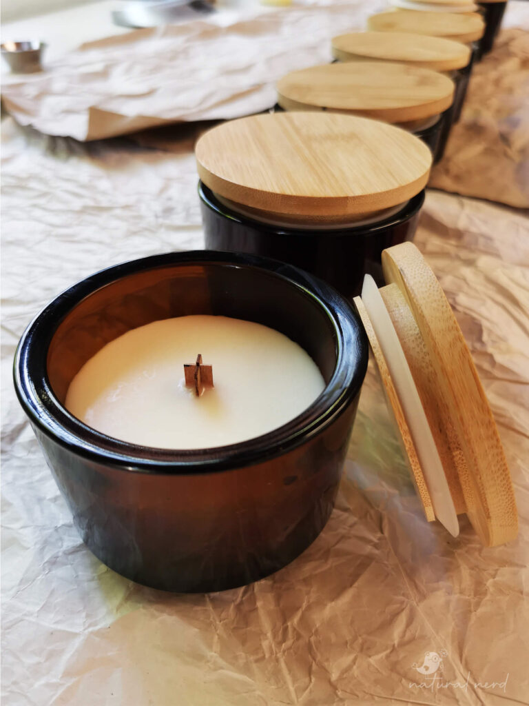 completed soy candles in amber containers with bamboo lids