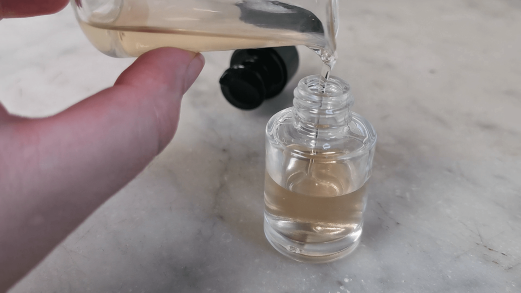 pouring final serum into bottle