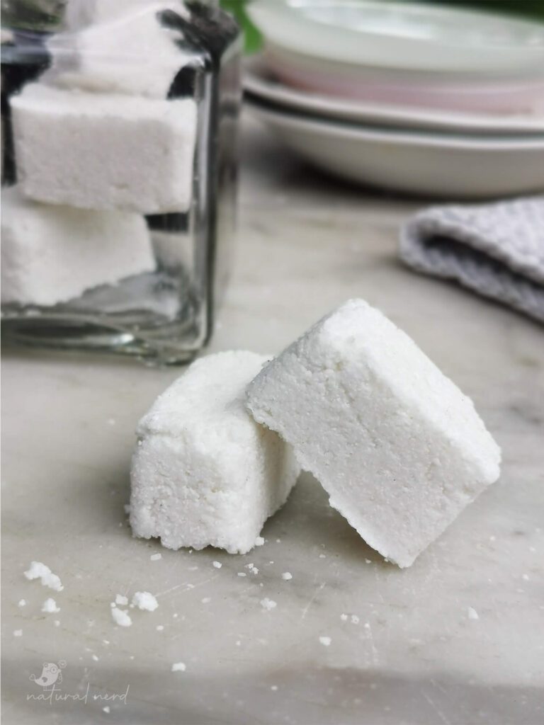 close-up of two homemade dishwasher tablets